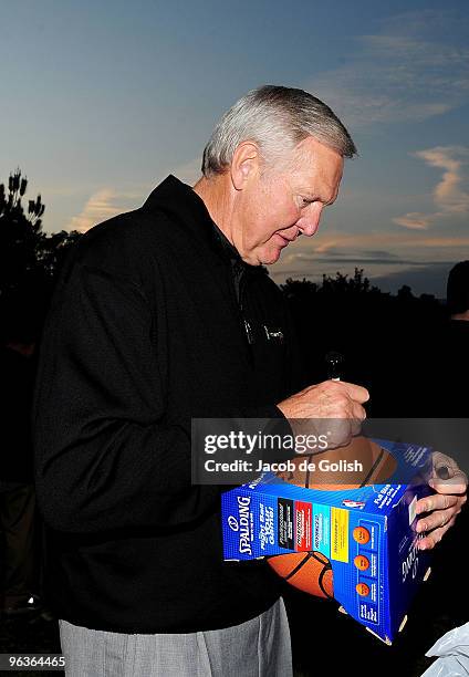 Jerry West signs autographs at the PGA Tour Golf Picnic before the start of the Northern Trust Open on February 2, 2010 in Pacific Palisades,...