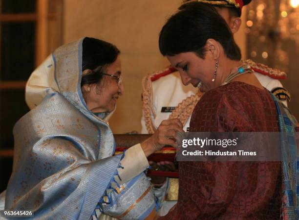 President of India Pratibha Patil , presents Padma Shri to journalist Barkha Dutt at the Rashtrapati Bhawan on May 10, 2008 in New Delhi, India.