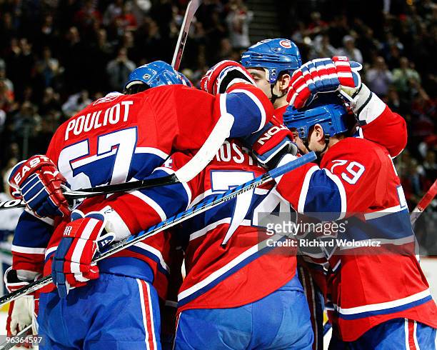 Sergei Kostitsyn of the Montreal Canadiens celebrates his first-period goal with teammates during the NHL game against the Vancouver Canucks on...
