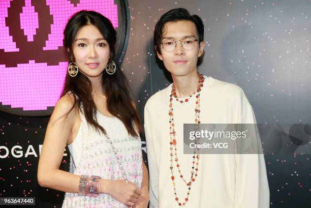 Singer Fiona Sit and singer Khalil Fong attend Chanel Coco Game Centre event on May 29, 2018 in Hong Kong, China.