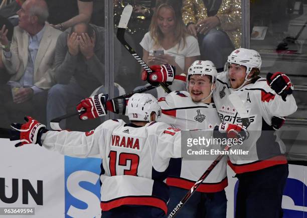 Jakub Vrana, Dmitry Orlov and Nicklas Backstrom of the Washington Capitals celebrate after Vrana assisted Backstrom on a first-period goal against...