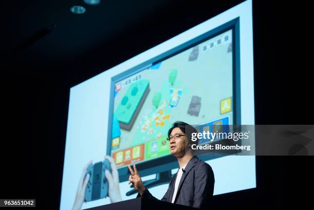 Shigeru Ohmori, planner and director of Game Freak Inc., speaks during a Pokemon Co. News conference where the company unveiled the video games...