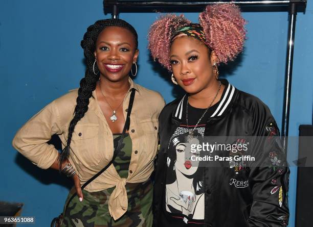 Personality/singer Kandi Burruss and rapper DaBrat backstage during the "Sum of My Music" tour at The Masquerade on May 29, 2018 in Atlanta, Georgia.