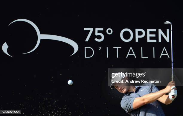 Oliver Fisher of England plays a bunker shot on the 18th hole during the Pro Am event prior to the start of the Italian Open at Gardagolf Country...