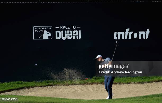 Oliver Fisher of England plays a bunker shot on the 18th hole during the Pro Am event prior to the start of the Italian Open at Gardagolf Country...