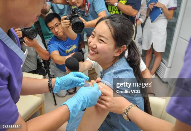 Chinese woman named Shi Jiayu from Beijing is injected with the 9-valent Human Papillomavirus Vaccine against cervical cancer at Boao Super Hospital...