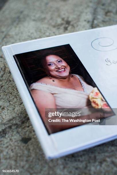 Photo of Ivette León Buitrago in a memorial book used in her funeral, during a portrait of her daughter, Miliana Montanez at the Santiago R. Palmer...