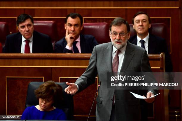 Spanish Prime Minister Mariano Rajoy giveds a speech during a session at the Lower House of Parliament in Madrid on May 30 two days before the...