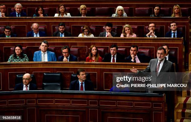 Spanish Prime Minister Mariano Rajoy giveds a speech during a session at the Lower House of Parliament in Madrid on May 30 two days before the...