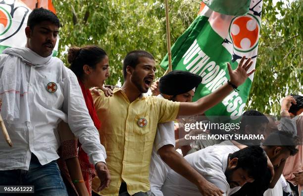 Members of the Indian youth congress shout anti-government slogans during a protest in New Delhi on May 30, 2018. - Members of the Indian youth...