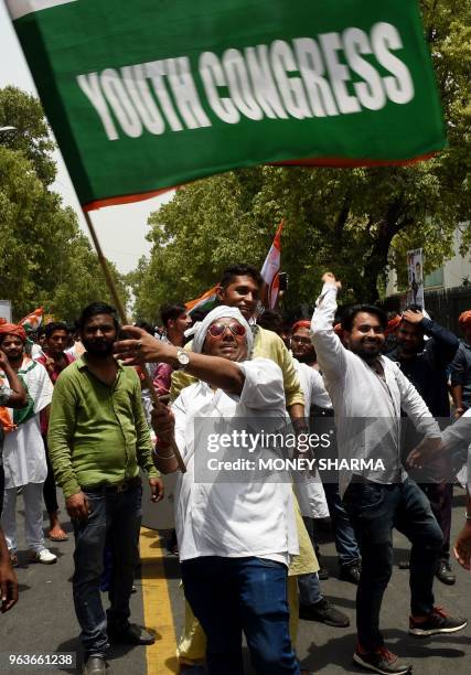 Members of the Indian youth congress shout slogans during a protest in New Delhi on May 30, 2018. - Members of the Indian youth congress are...