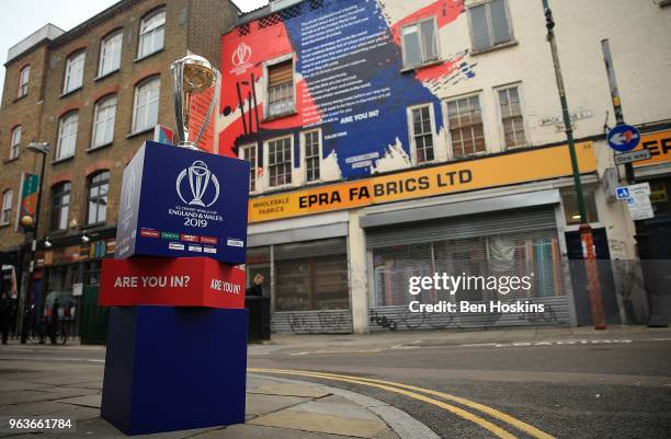 The ICC Cricket World Cup trophy on display on Brick Lane infront of the World Cup declaration mural by London poet Caleb Femi on May 30, 2018 in...