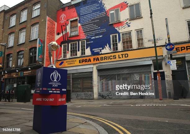 The ICC Cricket World Cup trophy on display on Brick Lane infront of the World Cup declaration mural by London poet Caleb Femi on May 30, 2018 in...