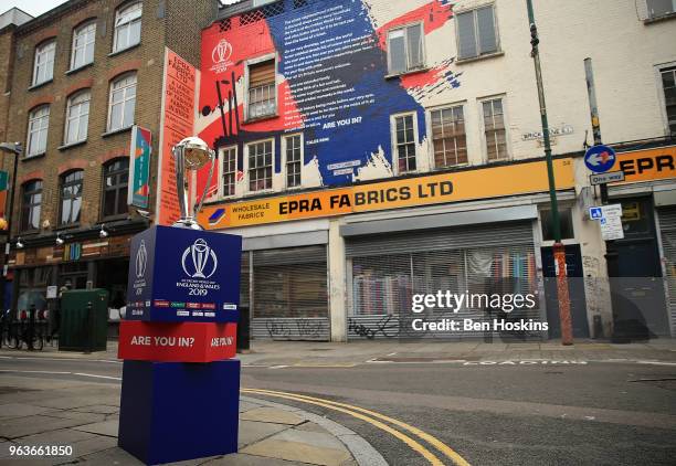 The ICC Cricket World Cup trophy on display on Brick Lane infront of the World Cup declaration mural by London poet Caleb Femi on May 30, 2018 in...