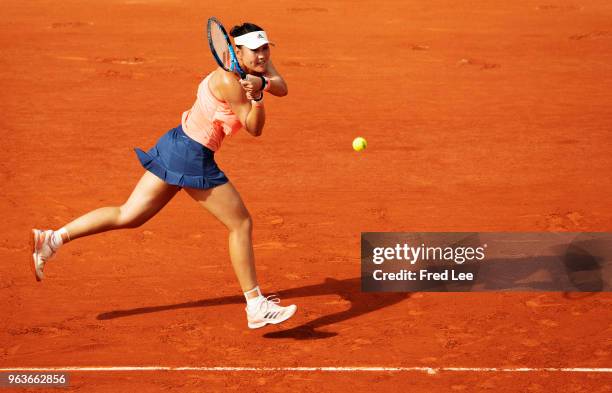 Yingying Duan of China in atcion during her ladies singles first round match against Caroline Garcia of France during day three of the 2018 French...