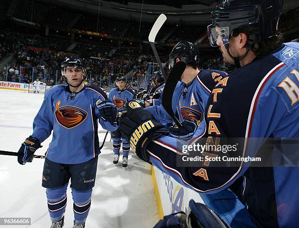 Rich Peverley and Ron Hainsey of the Atlanta Thrashers celebrate after a 2nd period goal against the Tampa Bay Lightning at Philips Arena on February...