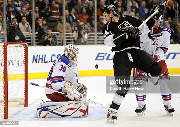 Henrik Lundqvist of the New York Rangers makes a save in front of Ryan Smyth of the Los Angeles Kings during the second period at the Staples Center...