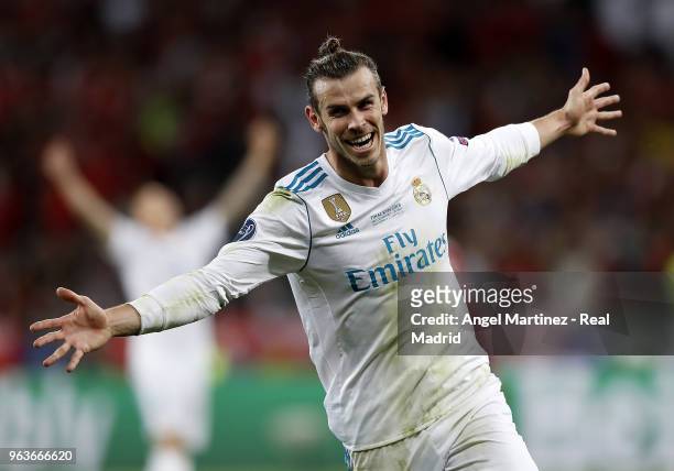 Gareth Bale of Real Madrid celebrates after scoring his team's third goal during the UEFA Champions League Final between Real Madrid and Liverpool at...