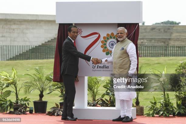 President of Republic Indonesia Joko Widodo shakes hands with Indian Prime Minister Narendra Modi while attending 'Indonesia - India Kite Exhibition...