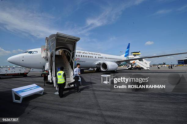 Static display of Garuda Indonesia Boeing 737-800 plane sits on the tarmac at the Singapore Airshow in Singapore on February 3, 2010. Indonesia's...