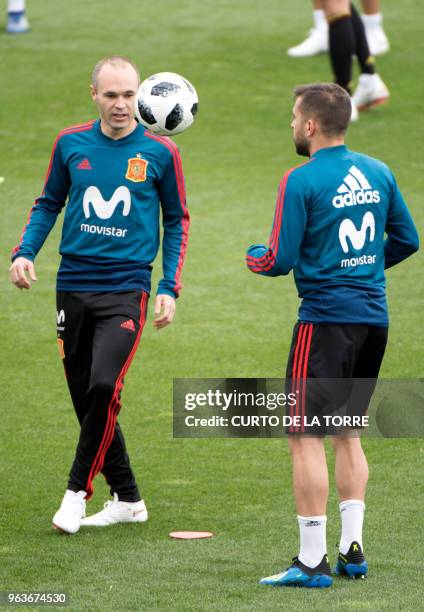 Spain's midfielder Andres Iniesta and Spain's defender Jordi Alba attend a training session at the Spanish Football Federation's "Ciudad del Futbol"...