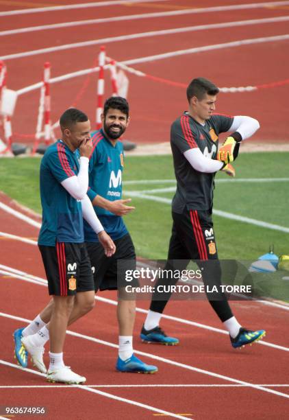 Spain's forward Rodrigo, Spain's forward Diego Costa and Spain's goalkeeper Kepa Arrizabalaga arrive for a training session at the Spanish Football...