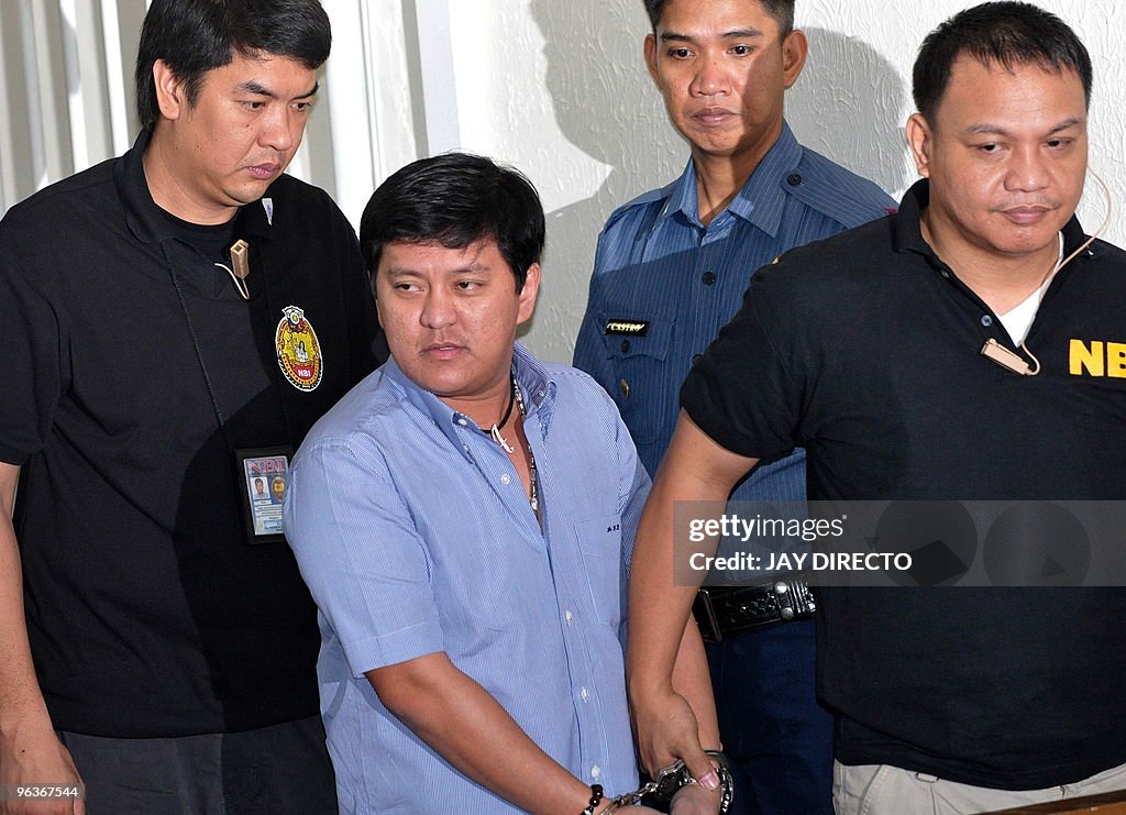 Andal Ampatuan Jnr. (C), escorted by age