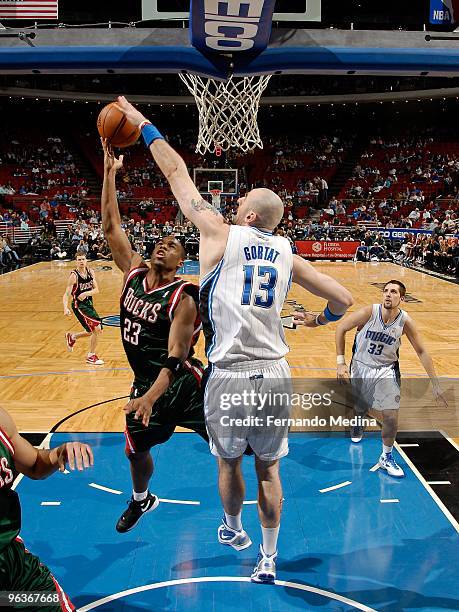 Marcin Gortat of the Orlando Magic blocks the shot attempted by Jodie Meeks of the Milwaukee Bucks during the game on February 2, 2010 at Amway Arena...