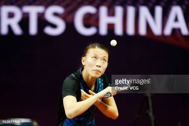 Wu Yang of China competes in the Women's Singles qualifying match against Bernadette Szocs of Romania during day two of the Seamaster 2018 ITTF World...