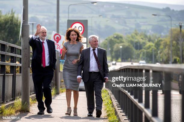 Britain's main opposition Labour party leader Jeremy Corbyn walks with Professor Deirdre Heenan and Shadow Secretary of State for Northern Ireland...
