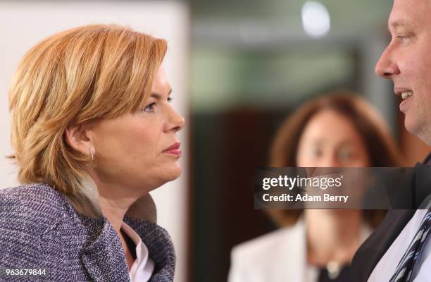 Agriculture and Consumer Protection Minister Julia Kloeckner speaks to Chancellery Minister Helge Braun as they arrive for the weekly German Federal...