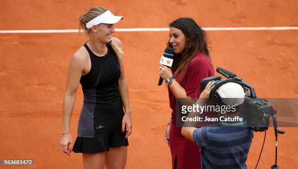 Marion Bartoli interviews Caroline Wozniacki of Denmark after her match on Day Two of the 2018 French Open at Roland Garros stadium on May 28, 2018...