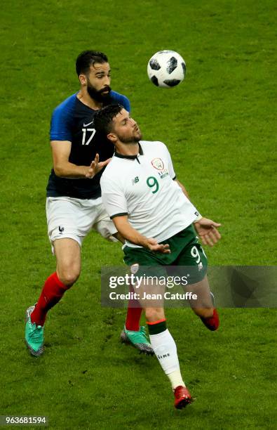 Shane Long of Ireland, Adil Rami of France during the international friendly match between France and Republic of Ireland at Stade de France on May...