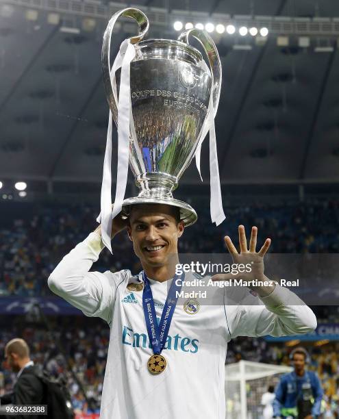 Cristiano Ronaldo of Real Madrid celebrates with The UEFA Champions League trophy following his sides victory in the UEFA Champions League Final...