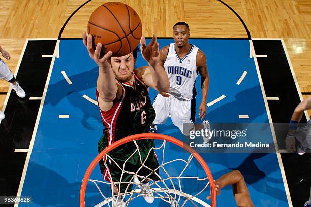 Andrew Bogut of the Milwaukee Bucks takes the ball to the basket against the Orlando Magic during the game on February 2, 2010 at Amway Arena in...