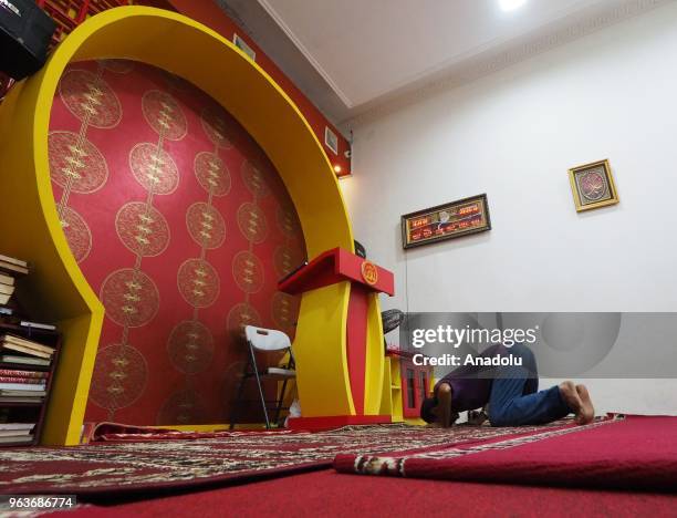 Man performs a prayer at Lautze 2 Mosque in Bandung, Indonesia on May 30, 2018. Lautze 2 Mosque, the oldest mosque was built in 1998 by ethnic...