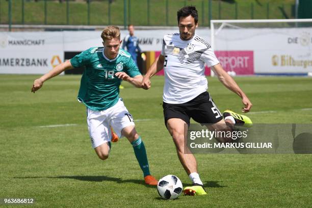 German player Johannes Eggestein vies with German national football team defender Mats Hummels during a test match on May 30, 2018 ahead of the FIFA...