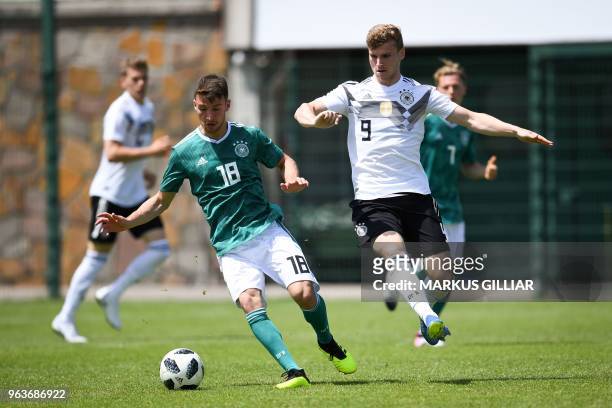 German player Dzenis Burnic vies with German national football team forward Timo Werner during a test match on May 30, 2018 ahead of the FIFA World...