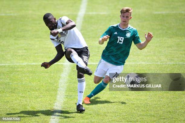 German national football team defender Antonio Rüdiger vies with U20 German player Johannes Eggestein German during a test match on May 30, 2018...