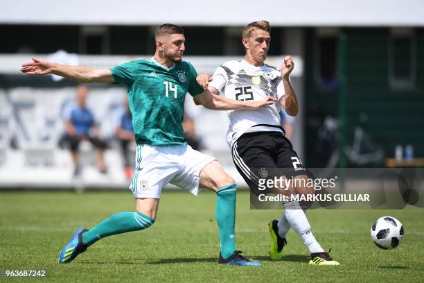 German player Julian Chabot vies with German national football team forward Nils Petersen during a test match on May 30, 2018 ahead of the FIFA World...