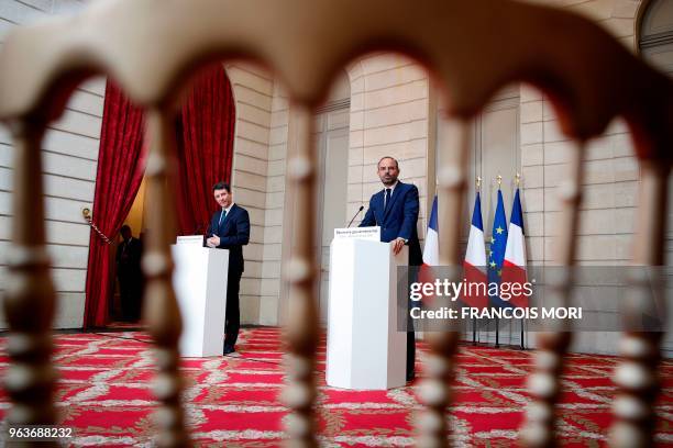 French Prime Minister Edouard Philippe and French Government's Spokesperson Benjamin Griveaux attend a joint press conference following the cabinet...