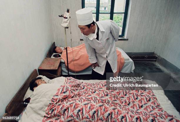 Hospital room with patient and a doctor in a hospital in Hwasan.