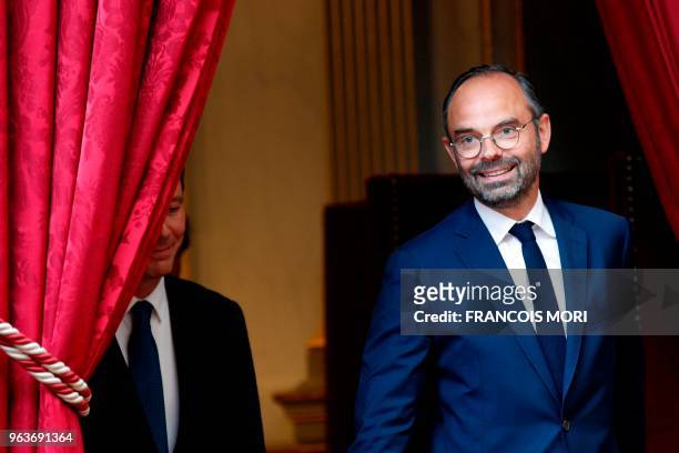 French Prime Minister Edouard Philippe and French Government's Spokesperson Benjamin Griveaux arrive for a joint press conference following the...