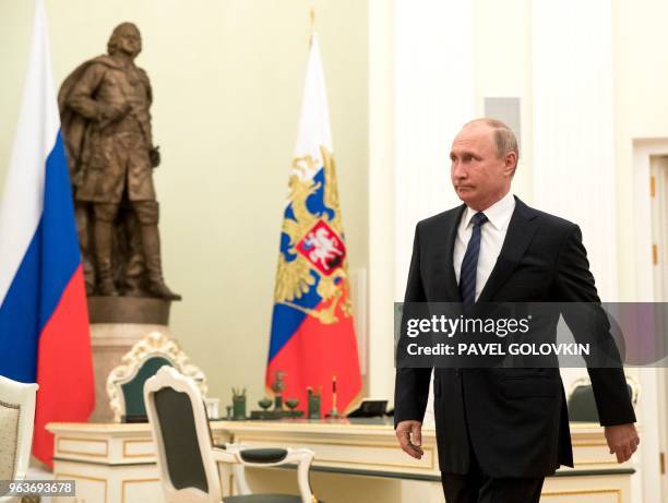 Russian President Vladimir Putin arrives to meet with Bulgarian Prime Minister during their meeting in the Kremlin in Moscow on May 30, 2018.