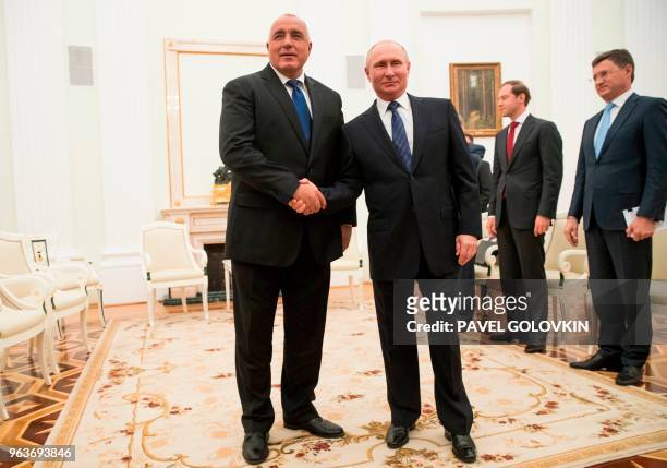 Russian President Vladimir Putin shakes hands with Bulgarian Prime Minister Boyko Borissov during their meeting in the Kremlin in Moscow on May 30,...
