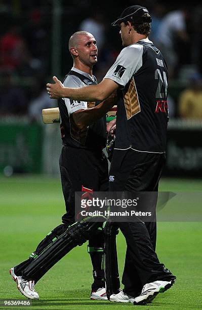 Peter Ingram is congratulated by Jacob Oram of New Zealand after winning the Twenty20 International match between New Zealand and Bangladesh at...