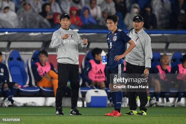 Head coach Akira Nishino of Japan instructs his player Genki Haraguchi during the international friendly match between Japan and Ghana at Nissan...