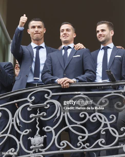 Real Madrid's Spanish Cristiano Ronaldo; Lucas Vazquez and Nacho Fernandez from the balcony of the headquarters of the regional government of Madrid...