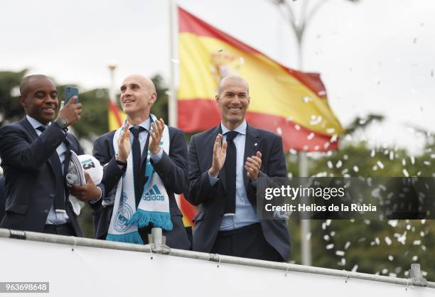 Head coach Zinedone Zidane and his team of assistants of Real Madrid holds up the Champions League trophy with his teammate Marcelo as they celebrate...