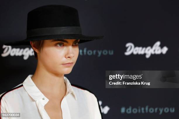 Cara Delevigne attends the Douglas store event on May 30, 2018 in Berlin, Germany.